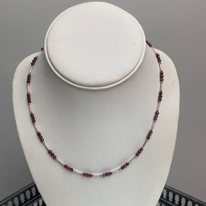 Garnet necklace with silver and gold finishings.